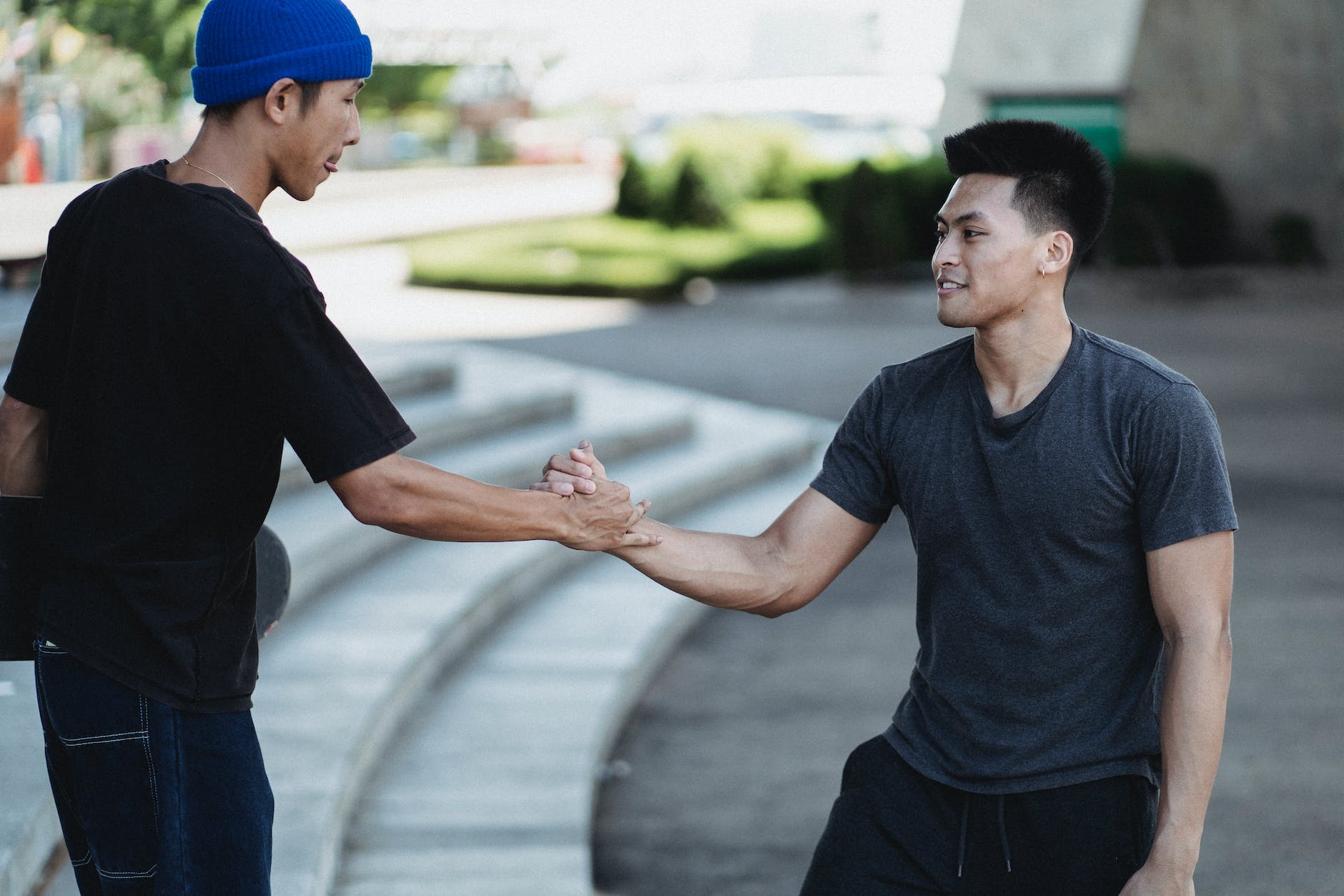 happy men meeting in city park